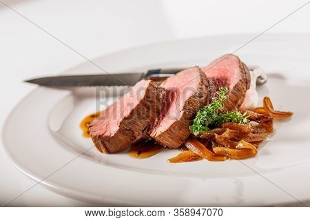 Roasted Beef Steak With Sauce And Vegetables