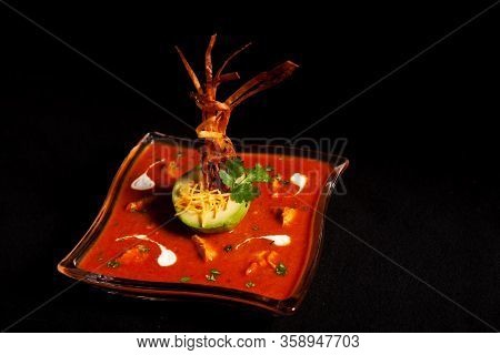 Seasoned Tomato Soup With Avocado And Decorations