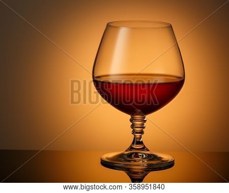 A Glass Of Cognac On A Dark Surface With A Reflection. Space For Text