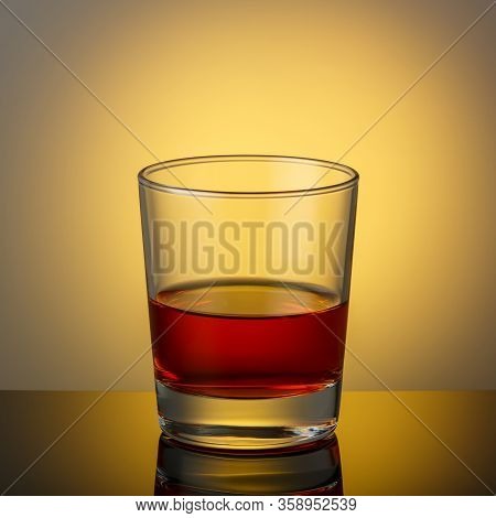 A Glass Of Whiskey On A Dark Surface With A Reflection.