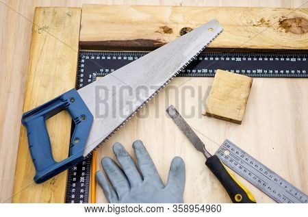 Carpenter At Work, Makes Crafts From Boards And Plywood
