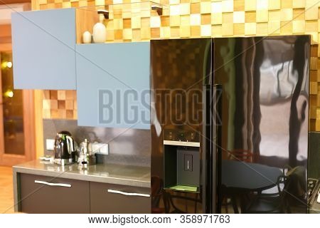 Fridge With Two Doors. Hanging Cabinet In The Kitchen On A Wooden Wall