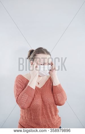 Covid-19 Pandemic Coronavirus. Close Up Of Middle Age Woman With Surgical Mask On Face Against Sars-