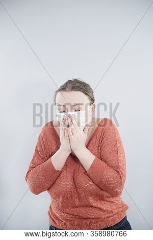 Covid-19 Pandemic Coronavirus. Close Up Of Middle Age Woman With Surgical Mask On Face Against Sars-