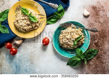 Risotto With Tomatoes On A Green Plate With Basil. Italian Food. Vegan Food Concept. Italian Cuisine