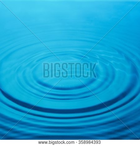 Circles On The Water, Blue Background. Abstraction.