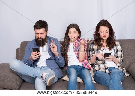 Smartphone Ruining Relations. Unhappy Child Complain Of Parents Addicted To Phones. Parents And Chil