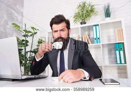 Comfy Workspace. Bearded Hipster Formal Suit Relaxing With Coffee. Office Life Is Unthinkable Withou