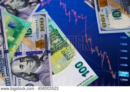 Us Dollar And Euro Banknotes Over Digital Screen With Real Life Exchange Chart, Usd Eur Parity Conce