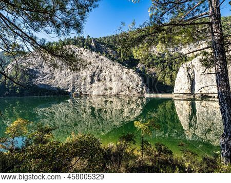 Embalse Del Molino De Chincha Reservoir With Turquoise Waters In Autumn At Cuenca Province In Castil