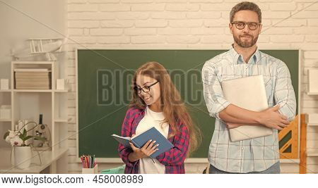 Kid And Dad In Classroom With Copybook And Computer At Blackboard, Estudy