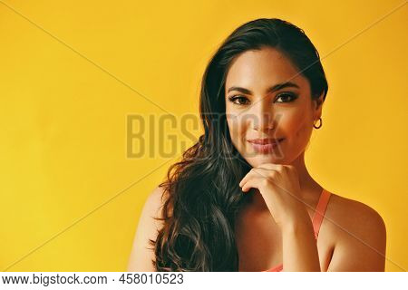 Headshot Beauty Shot Of Thoughtful Sensual Hispanic Latina Woman Smiling Young Adult With Hand On Ch