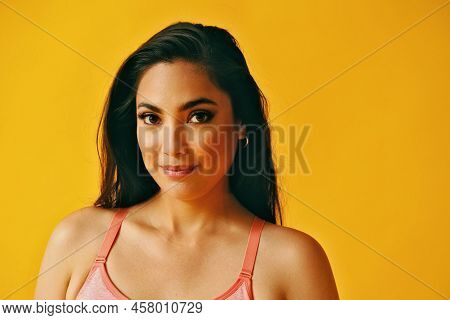 Headshot Beauty Shot Of Hispanic Latina Woman Smiling Smart Young Adult With Black Long Hair And Tan