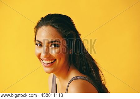 Headshot Beauty Shot Of Hispanic Latina Woman Toothy Smile Young Adult With Black Long Hair And Tank