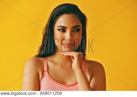 Headshot Beauty Shot Of Pensive Hispanic Latina Woman Young Adult With Black Long Hair And Tank Top 