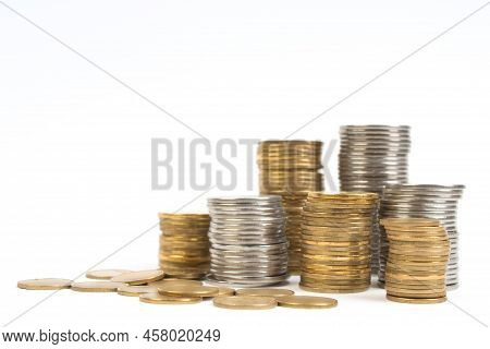 Gold Towers Made Out Of Gold And Silvery Coins, Stack Isolated On White.