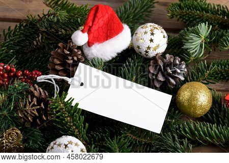 Christmas Rectangle White Tag Mockup With White Cord, Close Up On Natural Fir Tree Branch, With Cone