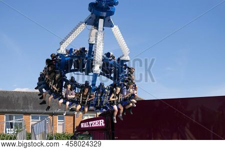 Grantham, Lincolnshire, England- July 9, 2022. People At The Stratosfear Thrill Ride. End Of The Rid