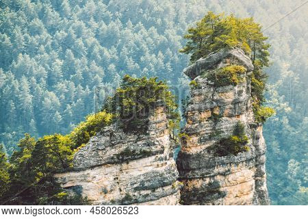 Close Up View Sairme Pillars In Summer With Stunning Green Caucasus Mountains Background. Hidden Gem