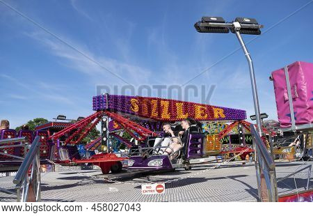Grantham, Lincolnshire, England- July 9, 2022. Teenage Boys In The Sizzler Ride At Grantham Fun Fair