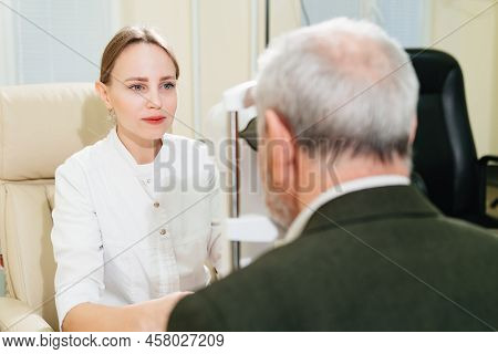 Ophthalmologist Examination Of Elderly Man On Corneo Topographer.modern Clinic