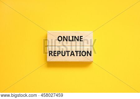 Online Reputation Symbol. Wooden Blocks With Concept Words Online Reputation On Beautiful Yellow Bac