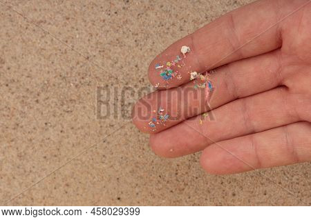 Pasteik Environmental Contamination. Fine Micro Plastic On The Hand.