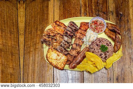 Varieties Of Grilled Meats With Rice, Fried Cheese And Tomato Salad, Plate With Assorted Types Of Gr