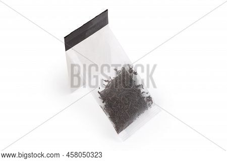Tea Bag Of Dry Black Tea Leaves Made With Food Plastic Mesh Rectangular Shape With Attached Paper La