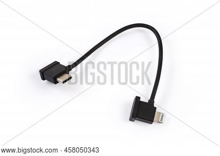 Short Cable With Plug Usb Type-c On The One Edge And Lightning At The Other Edge On A White Backgrou