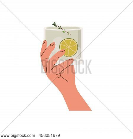 Female Or Male Hand Holding Rocks Glass With Classic Gin Tonic Cocktail. Old Fashioned Glass With Al