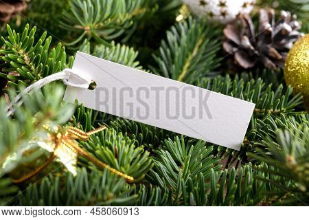 Christmas Rectangle Strip Tag Mockup With White Cord, Close Up On Natural Fir Tree Branch, With Cone