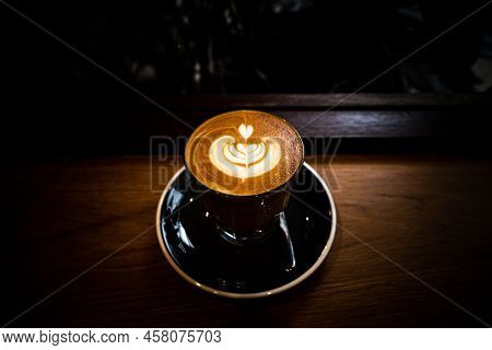 A Cup Of Coffee Latte Top View With Microfoam Milk Leaf Shape Foam.