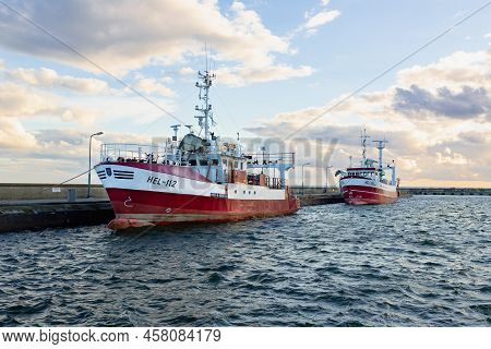 July, 09, 2022: Red And White Fishing Boats Moored In The Harbour In The Town Of Hel. Hel, Hel Penin