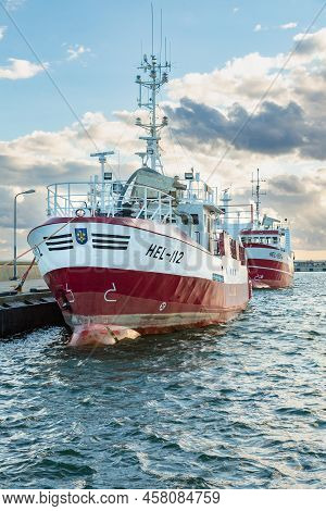 July, 09, 2022: Red And White Fishing Boats Moored In The Harbour In The Town Of Hel. Hel, Hel Penin