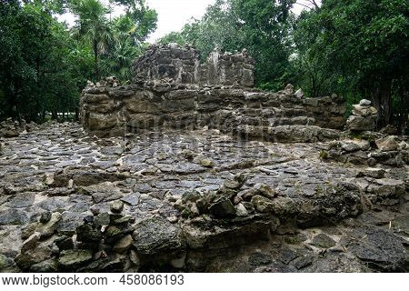 Ancient Mayan Ruins Called "xaman-ha" In The Jungle After A Rainstorm. Wet Stonework Of An Ancient A