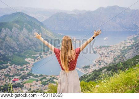 Woman Tourist Enjoys The View Of Kotor. Montenegro. Bay Of Kotor, Gulf Of Kotor, Boka Kotorska And W