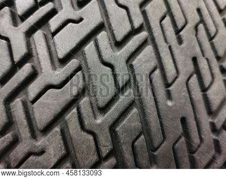 Car Tire Close-up With Tire Tread Pattern. Close-up. Abstract Background