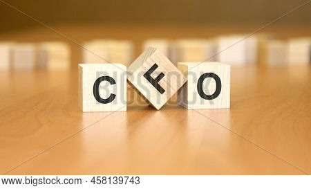 Cfo Text On Wooden Blocks, Financial Business Concept, Blue Background. Cfo - Chief Financial Office