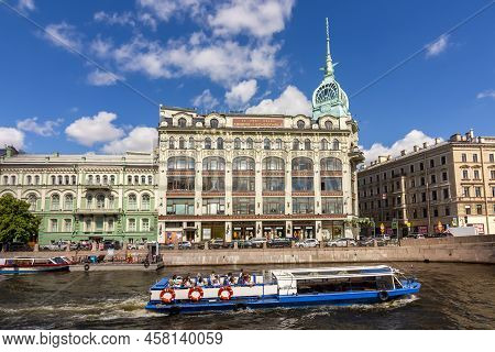 Saint Petersburg, Russia - July 2022: House At Red Bridge And Boats Along Moyka River