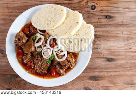 Fine Meat - Beef Goulash In A With Red Pepper On Wooden Table. Top View. Copy Space