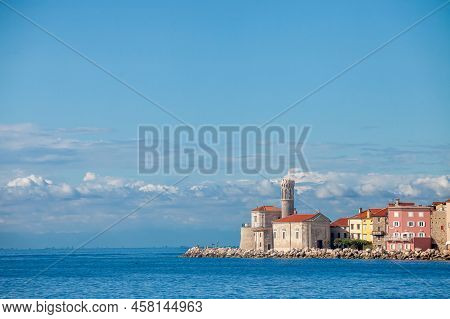 Panorama Of  Piran, Slovenia, With The Adriatic Sea In Front, With Blue Water And Sky, On A Wharf An
