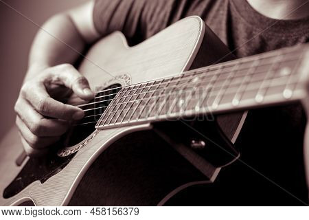 Musicians Are Playing Acoustic Guitar.