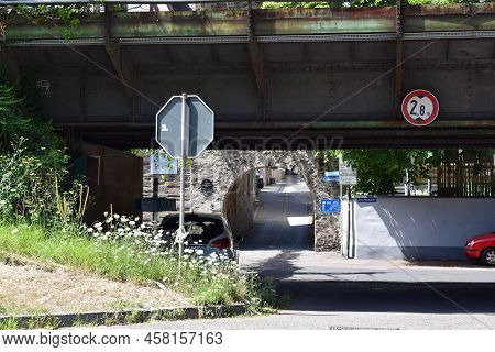 Winningen, Germany - 07 12 2022: Waterfront View To Winningen With A Railroad Bridge And Medieval Ci