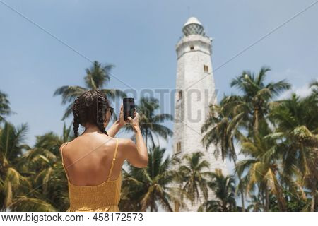 Romantic Woman Traveler In Dress Taking Photo On Smartphone Of Famous Landmarks Of Sri Lanka Country