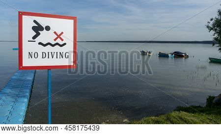 No Diving Sign At Beach, Lake Naroch, Belarus. Warning Sign Of Shallow Water. Warning Notice Sign Do