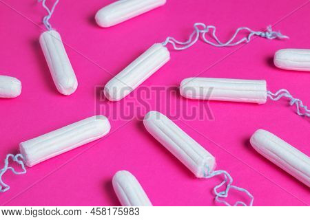 Medical Female Tampon On A Pink Background. Hygienic White Tampon For Women. Cotton Swab. Menstruati