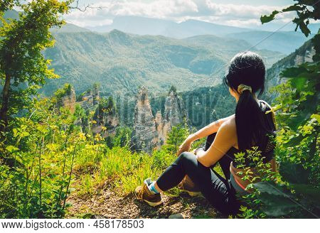 Female Woman Watch Sairme Pillars In Georgia. Famous Travel Destination In Caucasus