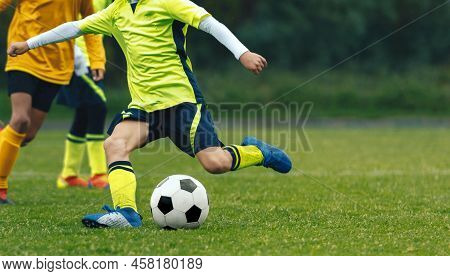Little Children Playing With Balls On The Football Field