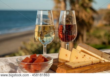 Spanish Hard Andalusian Cheese Filled With Sweet Sherry Served Outdoor With Membrillo Jam With Two G